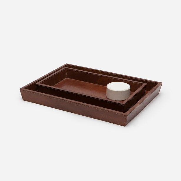 Pigeon & Poodle Hampton nesting trays in cognac, stacked with small white canister.