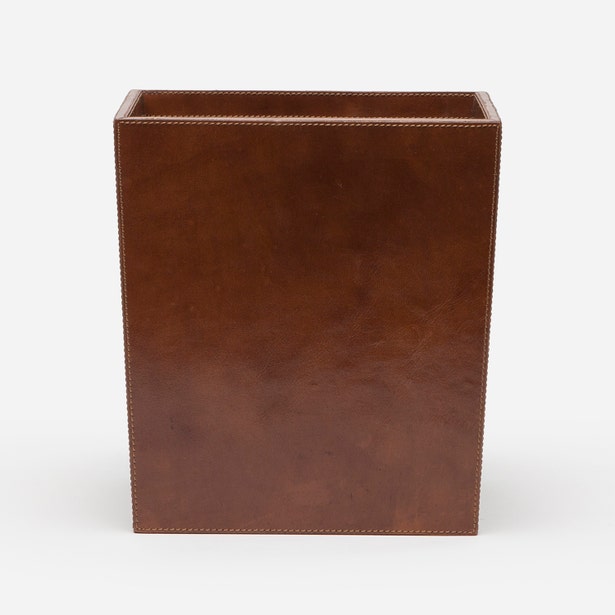 Pigeon & Poodle Hampton wastebasket in cognac leather with contrast stitching, front view.