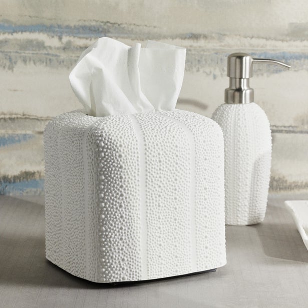 White textured tissue box cover and soap dispenser with raised dot pattern, styled on bathroom counter.