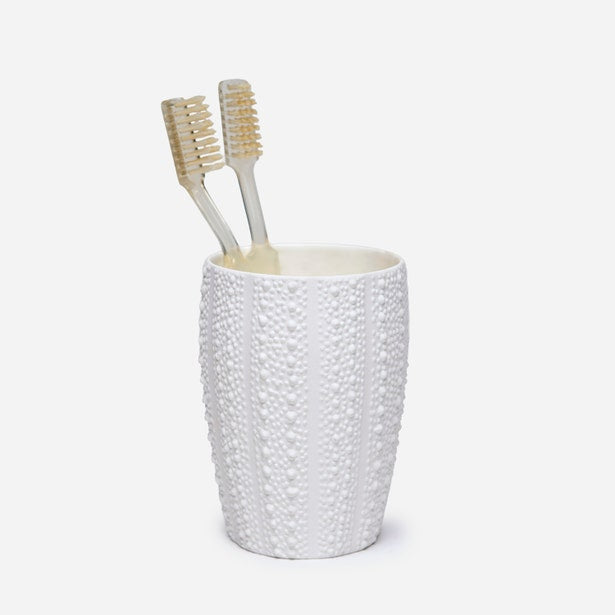 Pigeon & Poodle Hilo brush holder in white with raised dot texture, holding two toothbrushes.