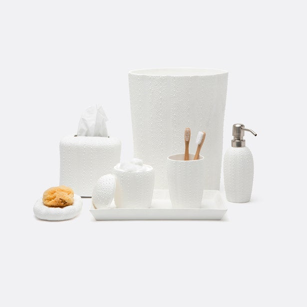 White textured bath accessory set with canister, soap dispenser, tissue box, and wastebasket.