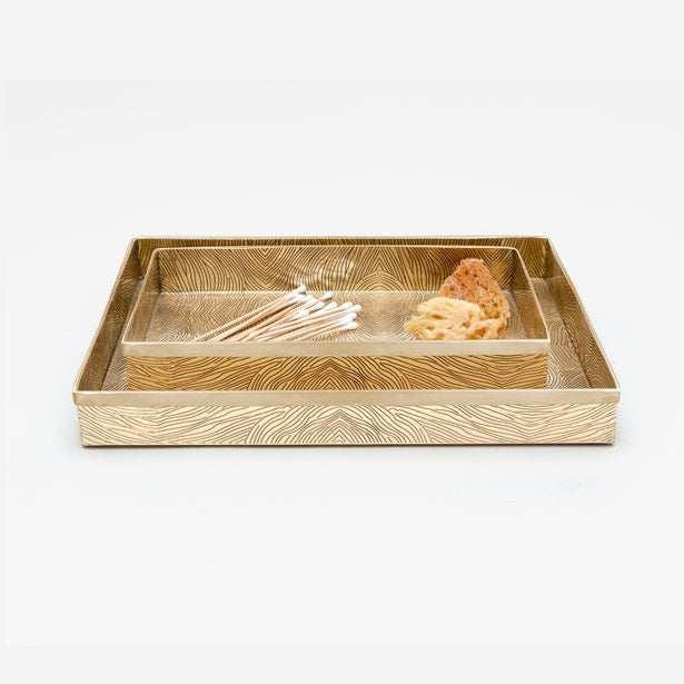 Pigeon & Poodle Humbolt gold nesting tray set with etched wave pattern, styled with cotton swabs.