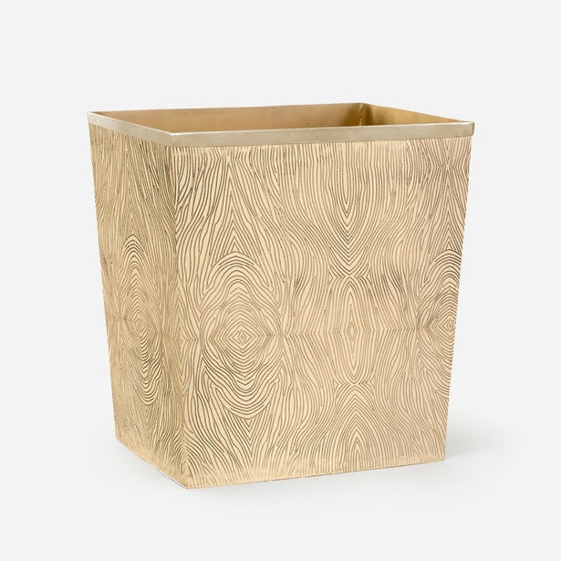 Pigeon & Poodle Humbolt wastebasket in champagne with embossed wood-grain pattern.