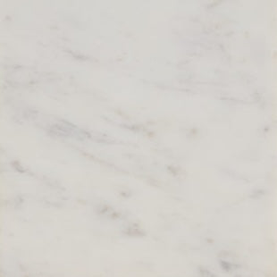 Close-up of white marble surface with grey veining on Kavala bath canister lid.