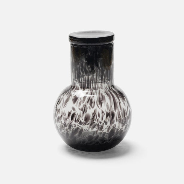 Lausanne carafe in black speckled glass with white swirl pattern and lidded top.