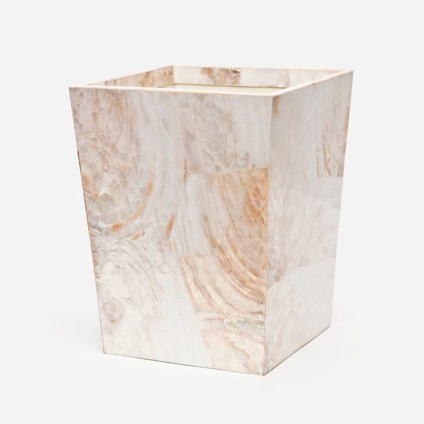 Pigeon & Poodle Lugano wastebasket in cream onyx with warm gold-veined marble panels.