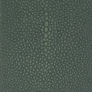 Close-up of dark teal pebbled texture on the Manchester bath canister surface.