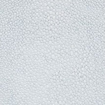 Close-up of white textured pebble-pattern surface on Manchester bath canister.