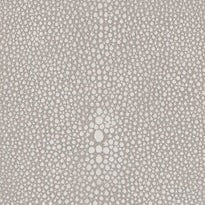 Close-up of taupe fabric with scattered ivory dot pattern texture.
