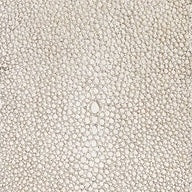 Close-up of ivory shagreen-textured surface with pebbled pattern detail.