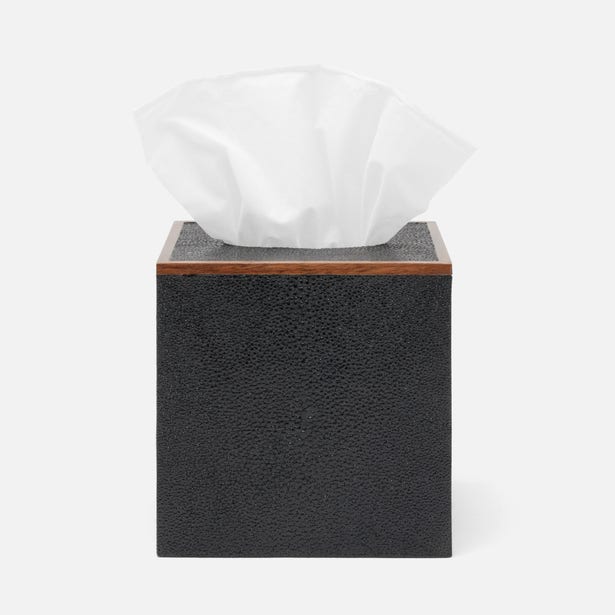 Black textured tissue box with walnut wood trim, white tissue pulled through top opening.