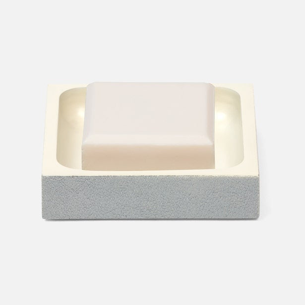 Pigeon & Poodle Manchester soap dish with bar of soap resting in ivory resin tray on concrete base.