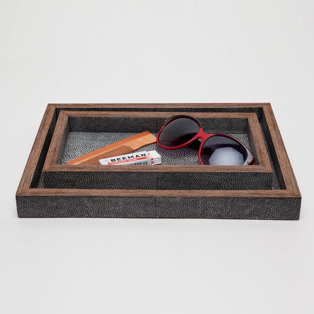 Pigeon & Poodle Manchester nesting trays styled with sunglasses and comb, charcoal shagreen texture.