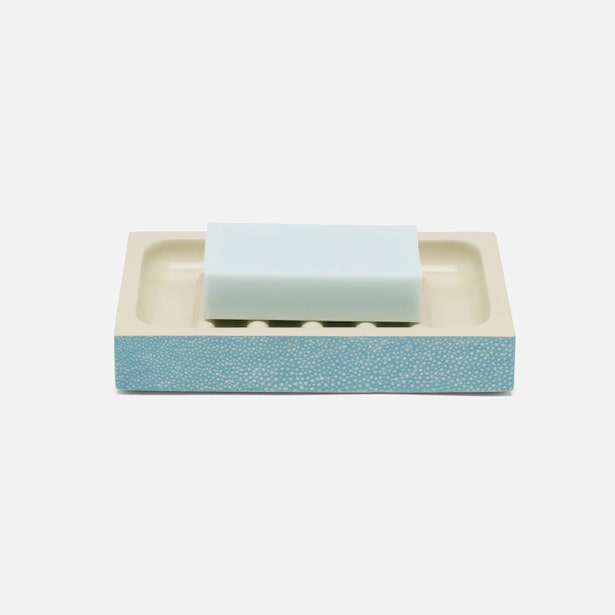 Pigeon & Poodle Manchester soap dish in ivory shagreen texture holding a pale blue soap bar.