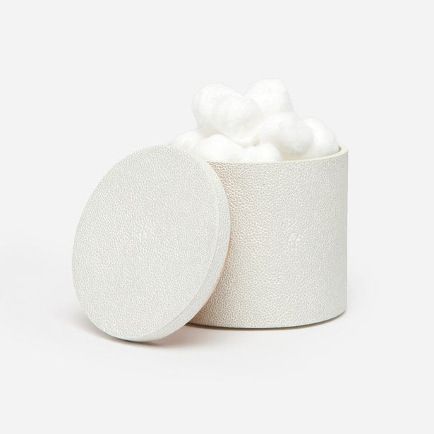 Ivory shagreen-textured bath canister with lid ajar, filled with white cotton balls.