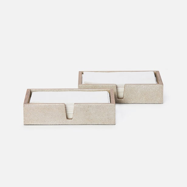 Two Manchester hand towel trays in sandy beige faux shagreen, holding folded white towels.
