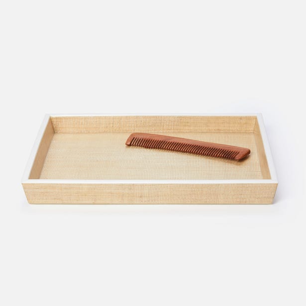 Pigeon & Poodle Maranello tray with woven raffia base and white lacquer trim, styled with a wooden comb.