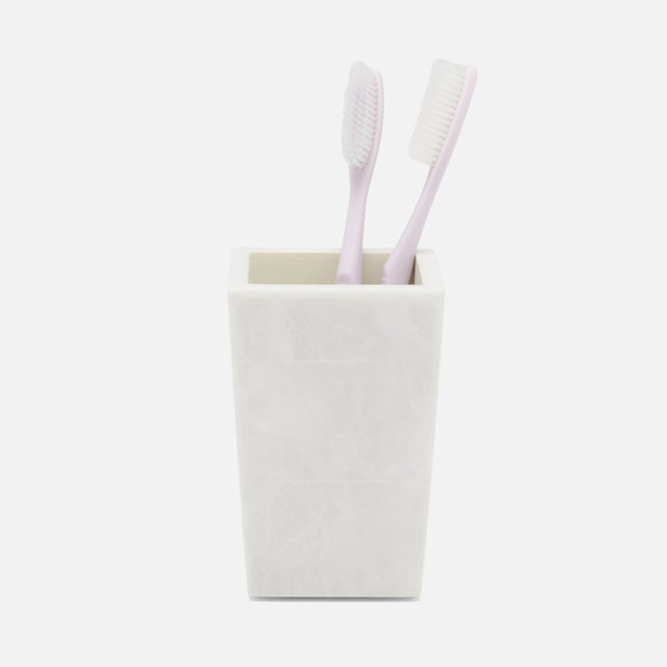 Pigeon & Poodle Milan brush holder in white marble resin, holding two toothbrushes.