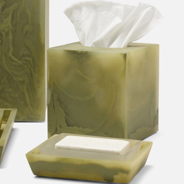 Olive green marbled resin tissue box holder and soap dish set styled together.