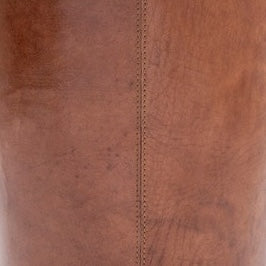 Close-up of tan leather wastebasket seam with saddle stitching detail.