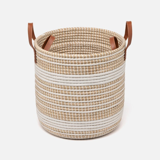 Close-up of Pigeon & Poodle Olinda hamper in natural and white stripe weave with tan leather handles.