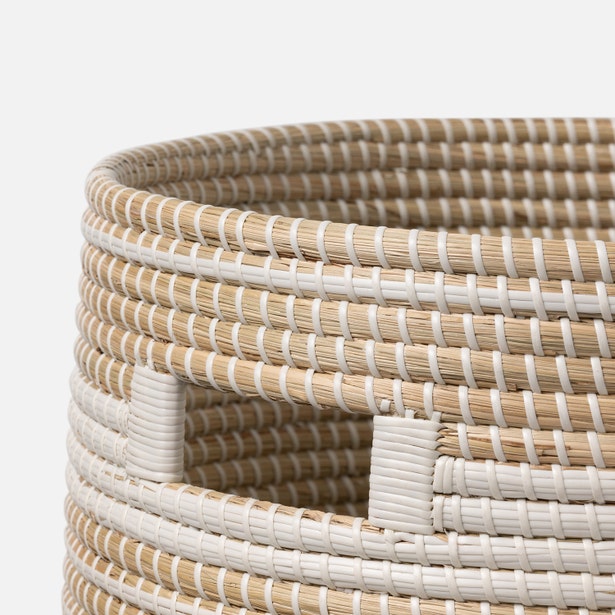 Close-up of Pigeon & Poodle Olinda hamper's woven seagrass texture in natural and white.
