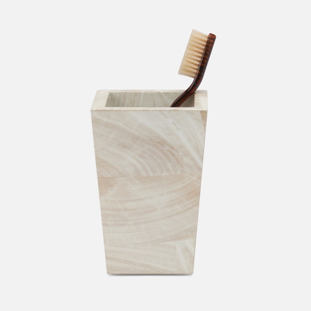 Pigeon & Poodle Palermo II brush holder in swirled ivory stone with toothbrush.