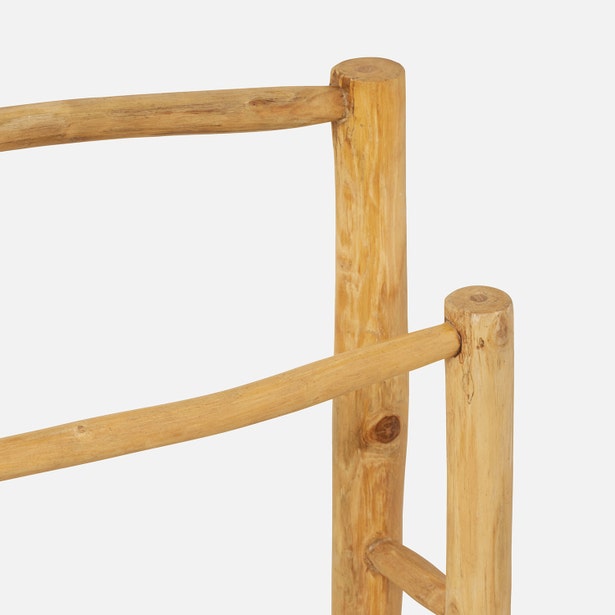 Close-up of Provo teak towel rack joints, showing natural wood grain and rounded rail detail.