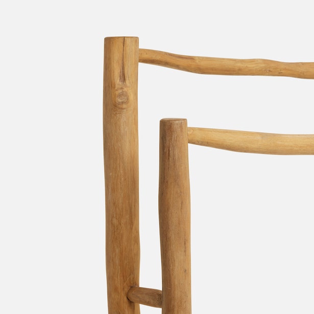 Close-up of Provo freestanding teak towel rack showing natural wood grain and joinery detail.