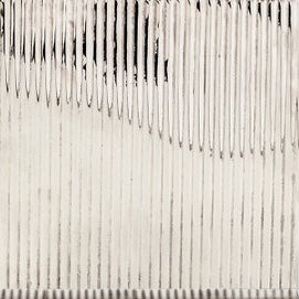 Close-up of ivory and silver striped textured surface on Redon bath canister.