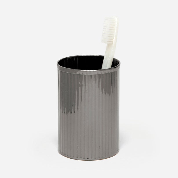 Pigeon & Poodle Redon brush holder in gunmetal, ribbed cylindrical form with toothbrush inside.
