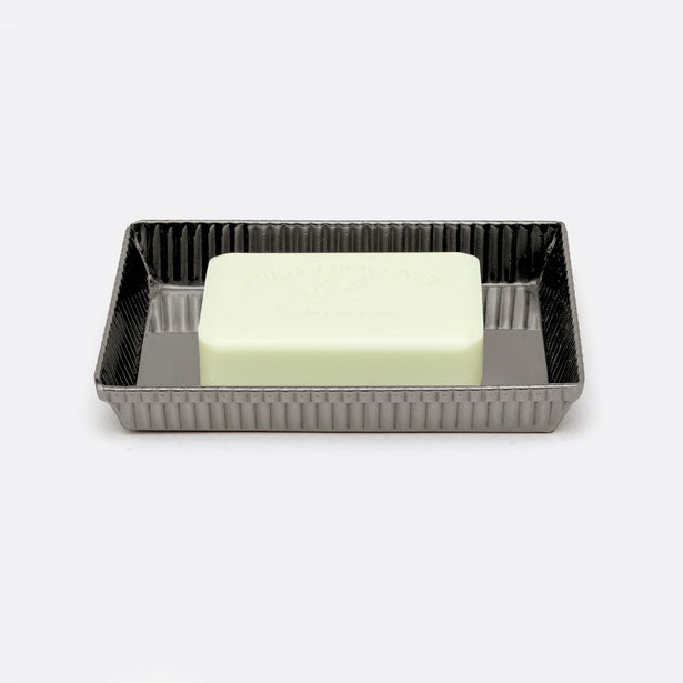 Regeon soap dish in ribbed gunmetal finish holding a pale green bar of soap, top angle.