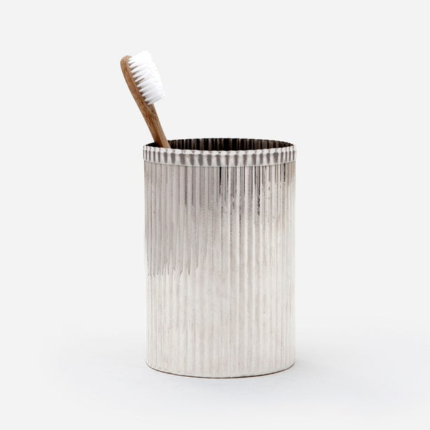 Pigeon & Poodle Redon brush holder in silver with vertical ribbed texture, holding a toothbrush.