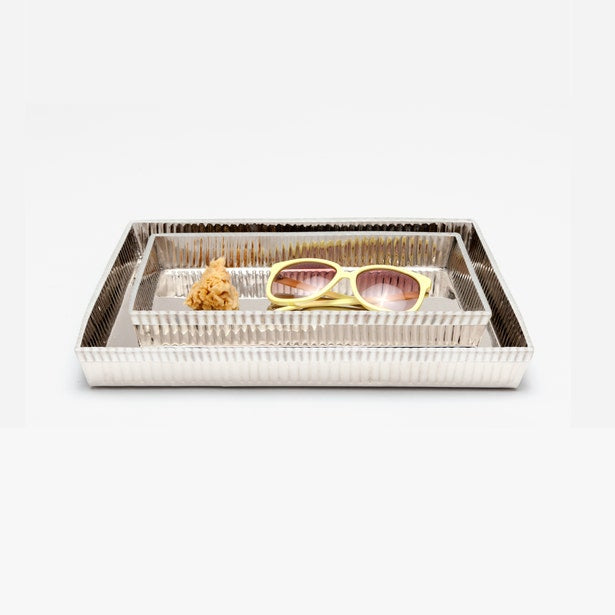 Pigeon & Poodle Redon silver ribbed nesting trays styled with sunglasses and a sponge.