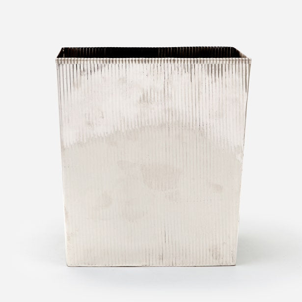 Pigeon & Poodle Redon wastebasket in polished silver with vertical ribbed texture.