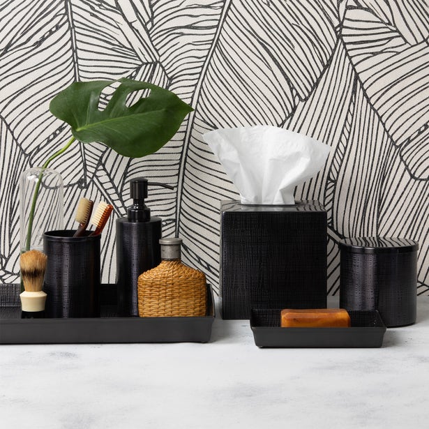 Black Pigeon & Poodle Remy bath canister styled with matching accessories on marble surface.