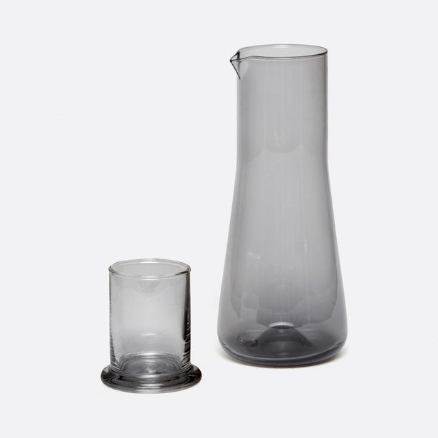 Pigeon & Poodle Salford carafe in smoky grey glass with matching tumbler on white background.