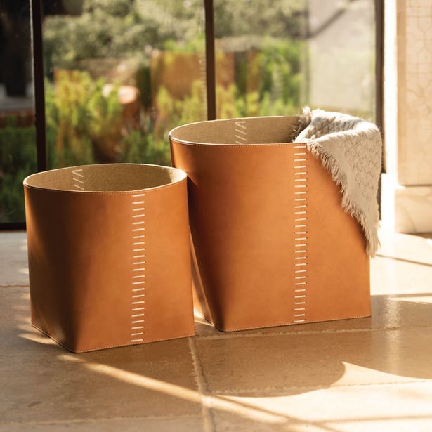 Pigeon & Poodle Salo tan leather basket set with contrast stitching, styled outdoors.