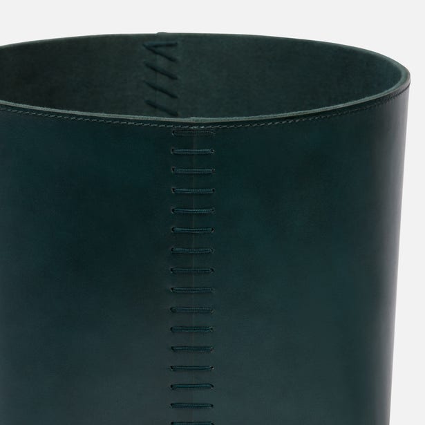 Close-up of Pigeon & Poodle Salo basket in deep teal leather with vertical saddle stitch detail.
