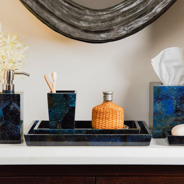 Pigeon & Poodle Santorini blue marbled bathroom set styled on vanity with mirror.