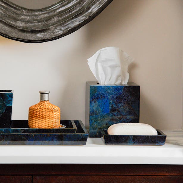 Pigeon & Poodle Santorini soap dish in blue stone, styled on marble vanity with matching accessories.