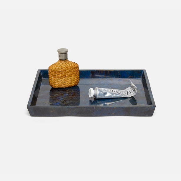 Pigeon & Poodle Santorini tray in navy resin, styled with woven bottle and silver tube.
