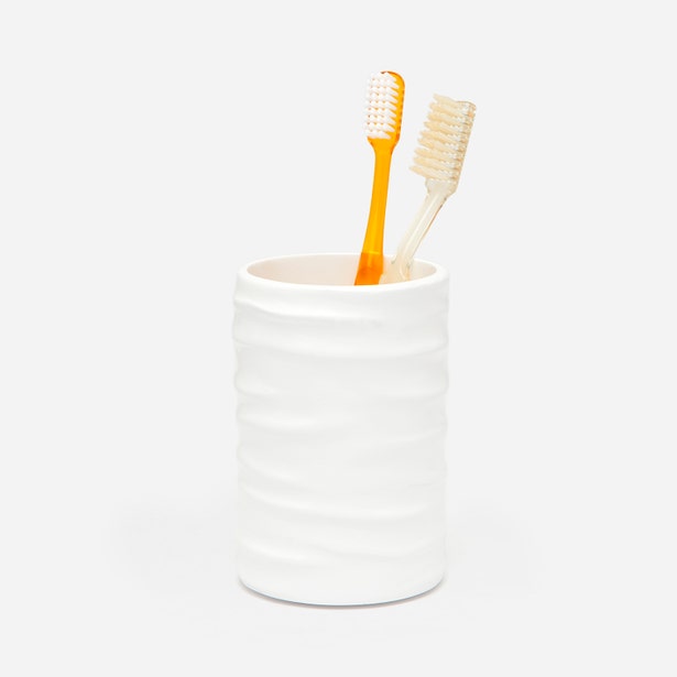 Pigeon & Poodle Solin brush holder in white with ribbed texture, holding two toothbrushes.