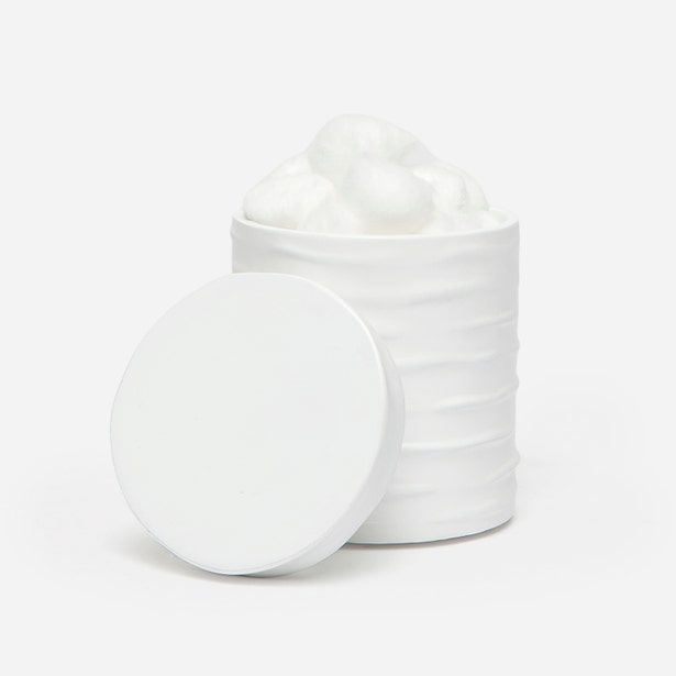 Pigeon & Poodle Solin white ribbed bath canister with lid, filled with cotton balls.