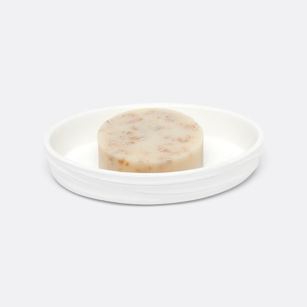 Pigeon & Poodle Solin white ceramic soap dish with round natural bar soap.