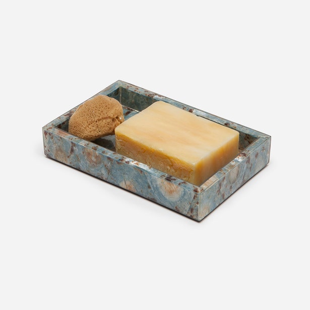 Blue-grey marbled resin soap dish holding a bar of soap and small sponge, angled view.