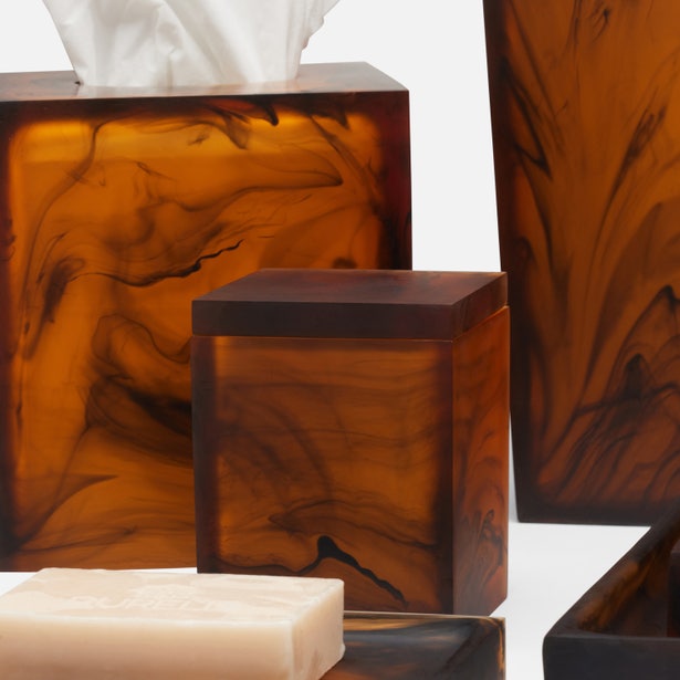 Pigeon & Poodle Tavira bath canister in amber tortoise resin, styled with matching bath accessories.