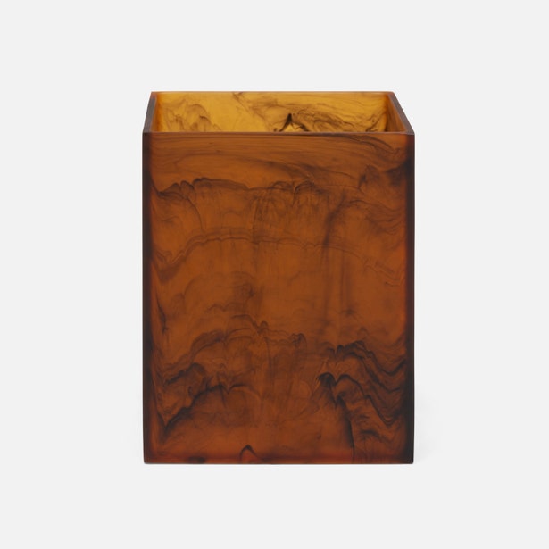 Pigeon & Poodle Tavira wastebasket in amber tortoise resin with swirled marbling effect.