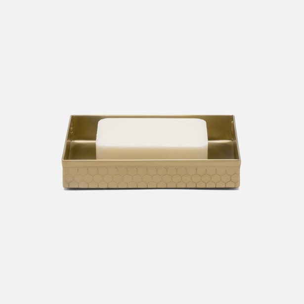 Pigeon & Poodle Temara soap dish in gold with honeycomb texture holding ivory bar soap.