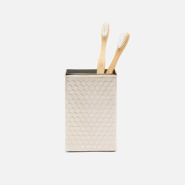 Pigeon & Poodle Temara brush holder in nickel with honeycomb texture, holding two bamboo toothbrushes.